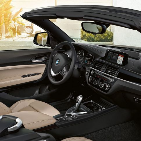 BMW 2 Series Convertible, driving shot from the side BMW 2 Series Convertible, driving shot from the side