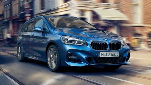 Driving Experience Control BMW 2 Series Gran Tourer BMW 2 Series Gran Tourer driving on a busy city road