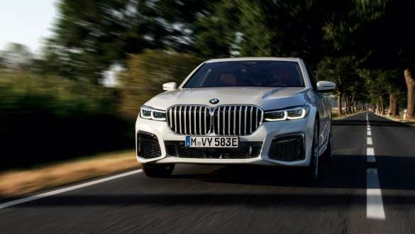 BMW 7 Series Saloon plug-in hybrid G11 G12 front view driving BMW 7 Series Saloon plug-in hybrid G11 G12 front view driving on the street