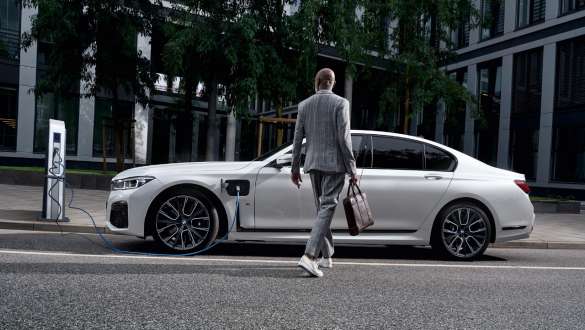 BMW 7 Series Saloon plug-in hybrid G11 G12 side view charging BMW 7 Series Saloon plug-in hybrid G11 G12 side view charging with model