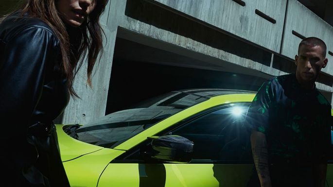 BMW M4 Competition Coupé G82 2020 Sao Paulo Yellow side view with man and woman BMW M4 Competition Coupé G82 2020 Sao Paulo Yellow side view with man and woman