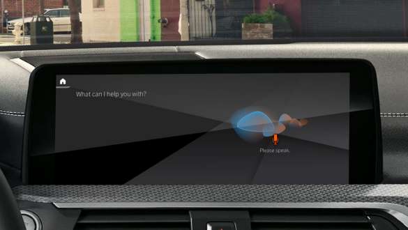 Remote Software Upgrade BMW X5 Woman drinking a cup of coffee while she updates the software of her BMW X5 via Remote Software Upgrade G05 2018