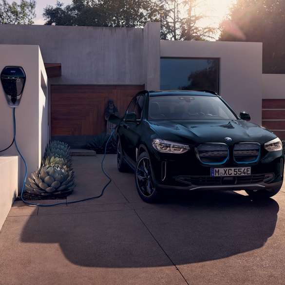 High-Power Charging BMW iX3 G08 front view at charging at home High-Power Charging BMW iX3 G08 2020 Black front view charging at home