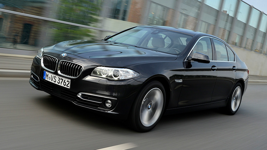 BMW 518d Saloon (F10 LCI) three-quarter side view driving BMW 518d Saloon (F10 LCI) three-quarter side view driving