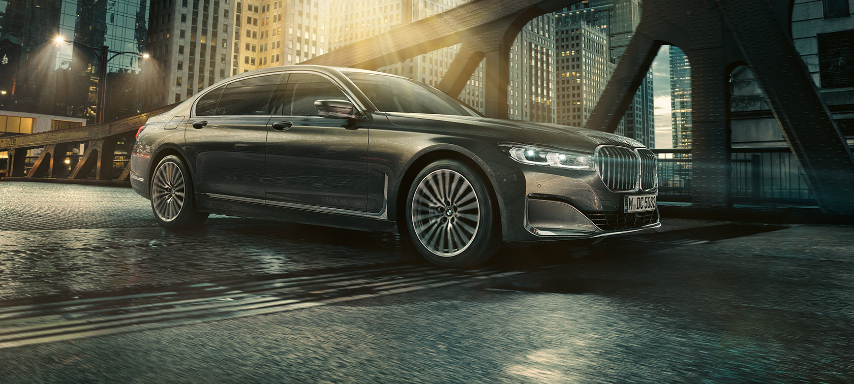 BMW 7 Series Saloon side view BMW 7 Series Saloon in side view with opened door in front of illuminated hotel