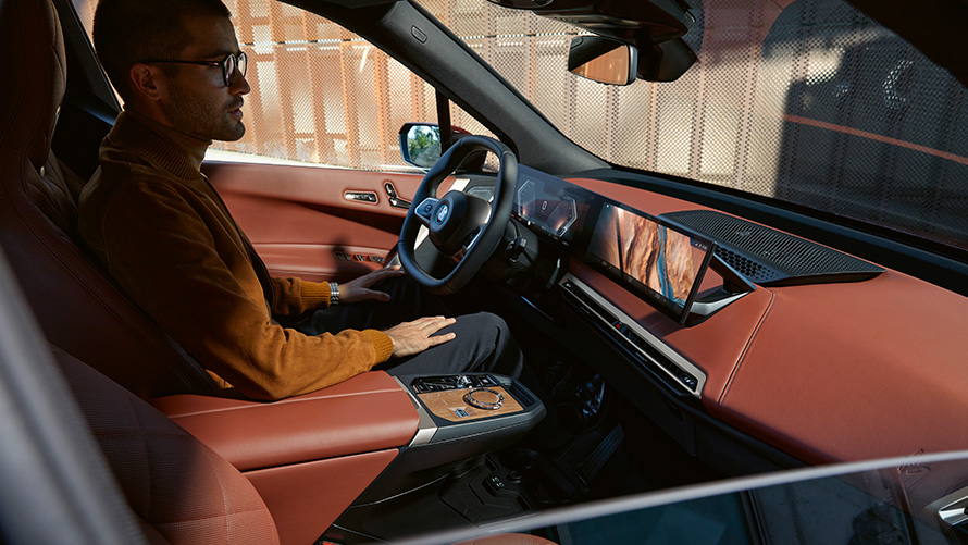 BMW iX i20 electric SUV interior BMW iX i20 2021 electric SUV interior Suite leather Castanea man in drivers seat