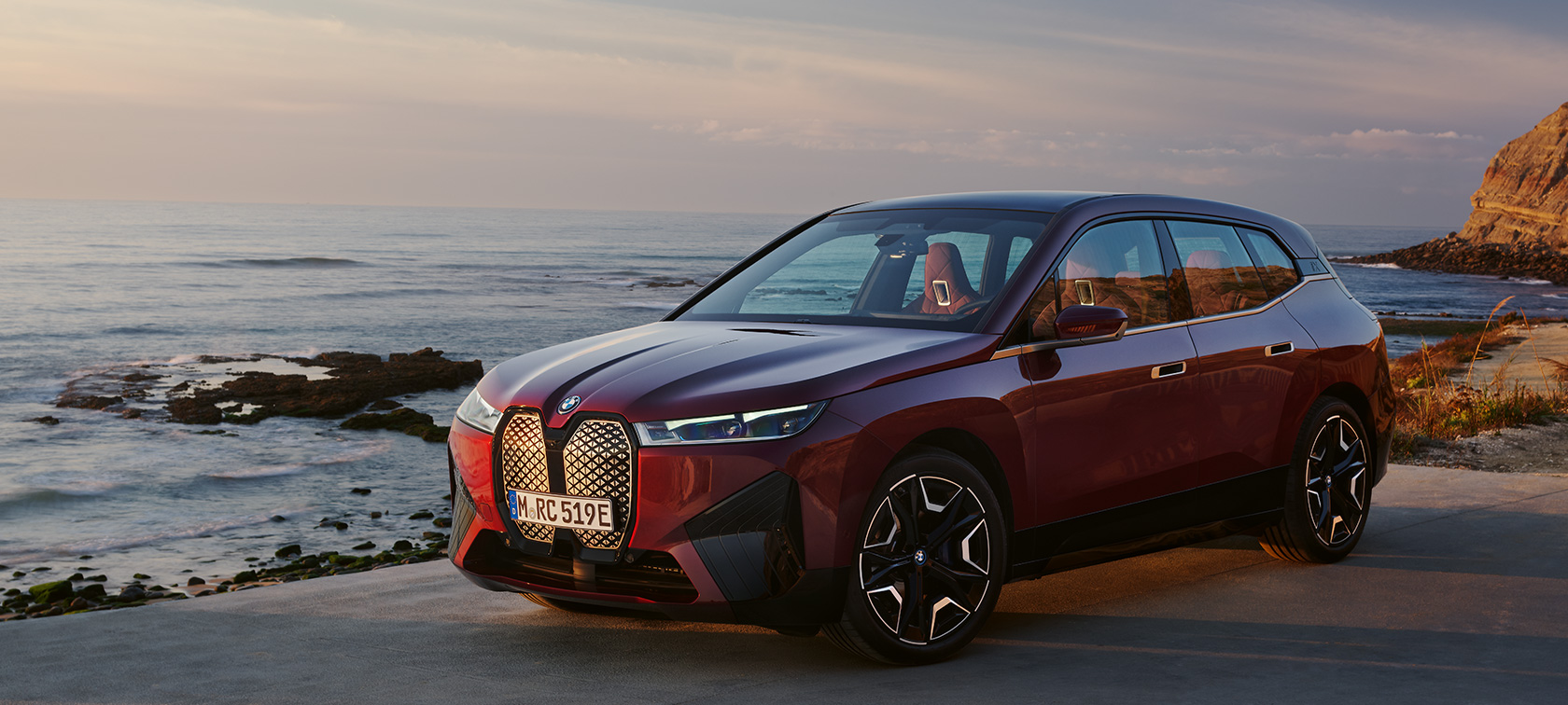BMW iX i20 2021 electric SUV Aventurin Red metallic three-quarter view BMW iX i20 2021 electric SUV Aventurin Red metallic three-quarter view