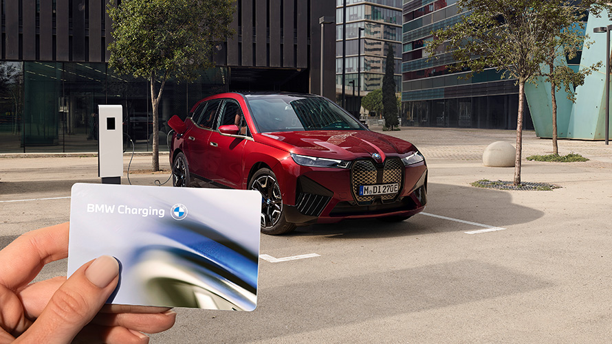 BMW iX i20 2021 electric SUV BMW iX xDrive50 Aventurin Red charging at a public high power charging station