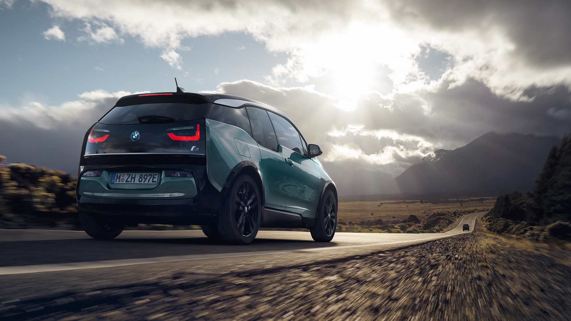 BMW i3 2020 Blue Ridge Mountain with Frozen Grey Highlight three-quarter rear view driving on highway BMW i3 I01 2020 Blue Ridge Mountain with Frozen Grey Highlight three-quarter rear view driving on highway