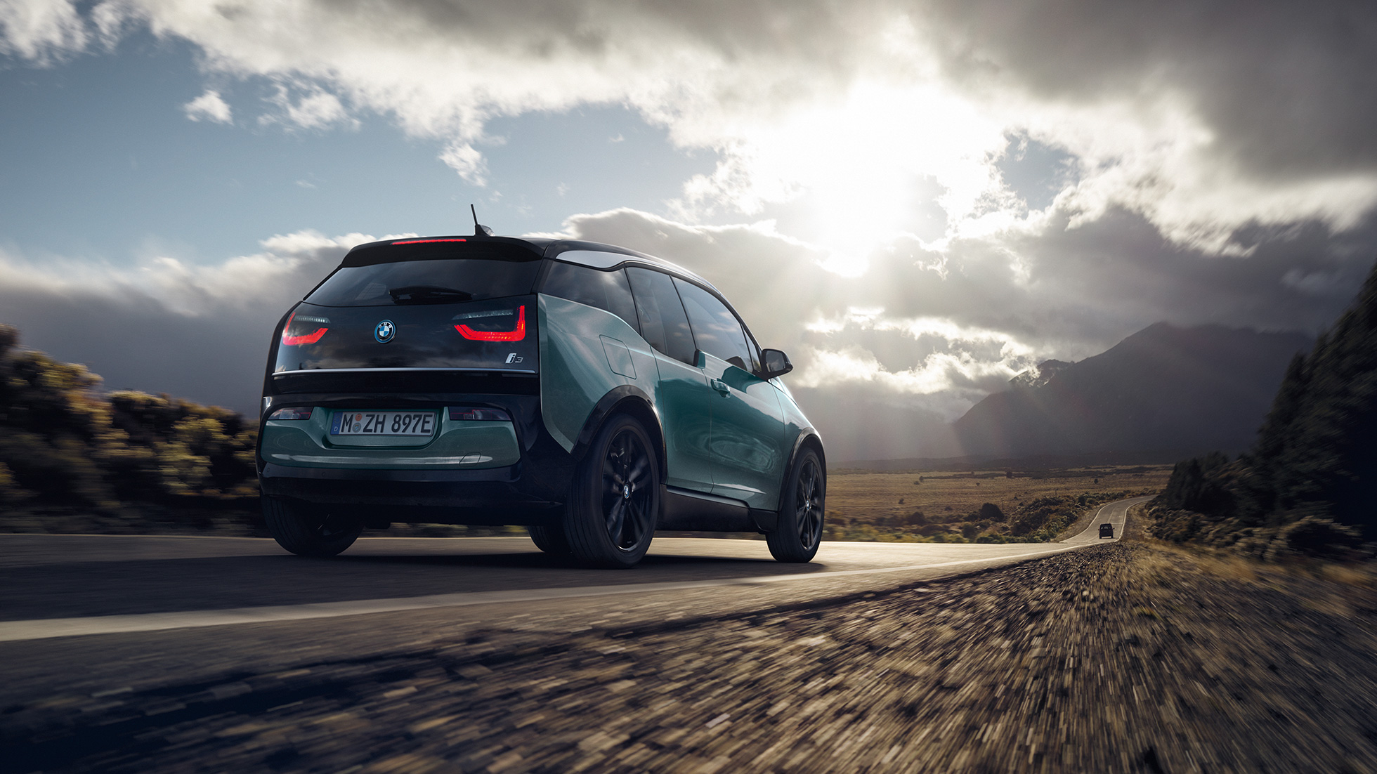 BMW i3 2020 Blue Ridge Mountain with Frozen Grey Highlight three-quarter rear view driving on highway BMW i3 I01 2020 Blue Ridge Mountain with Frozen Grey Highlight three-quarter rear view driving on highway