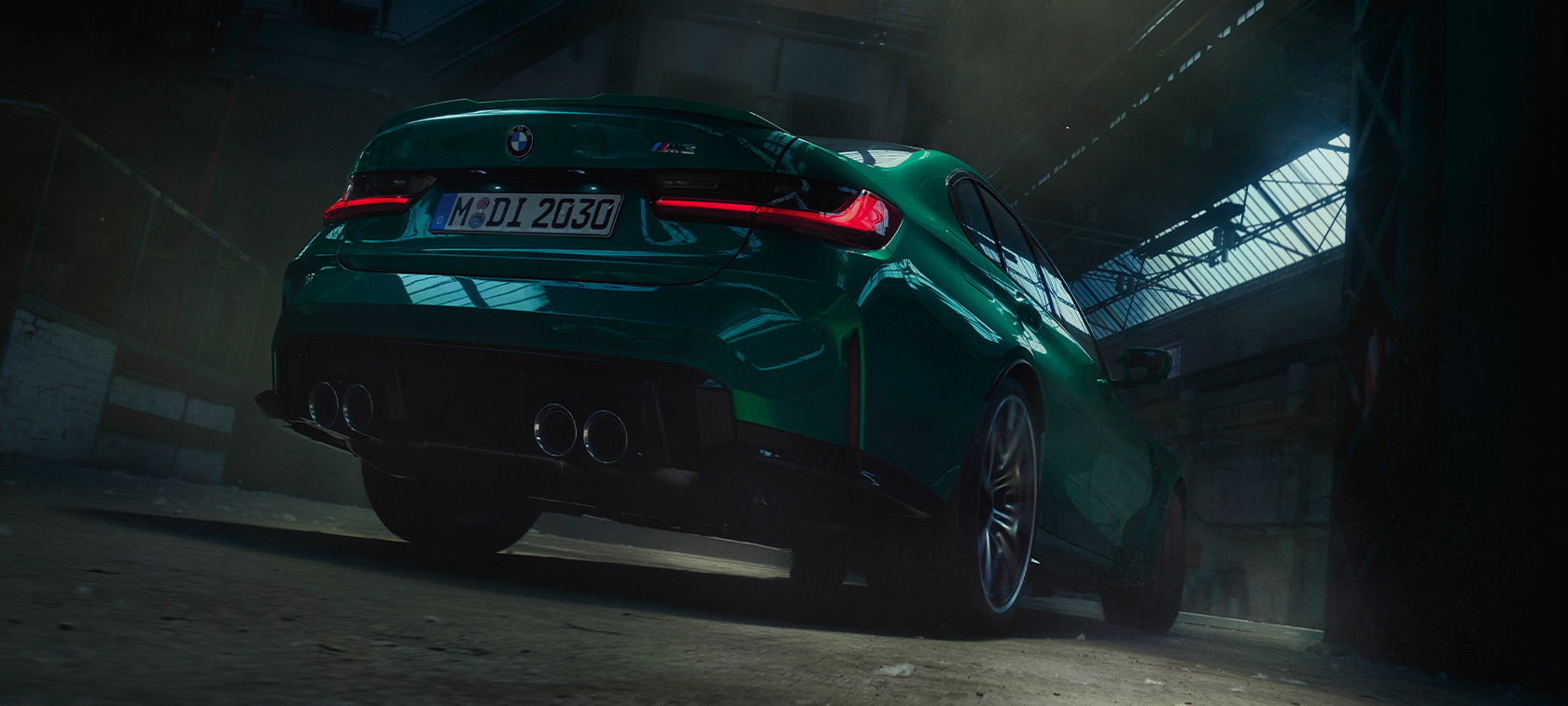 BMW M3 Saloon G80 2020 three-quarter rear worm's-eye view BMW M3 Saloon G80 2020 Isle of Man Green metallic three-quarter rear view worm's-eye view