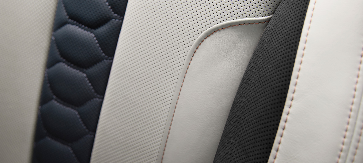 BMW X6 M First Edition F96 2020 interior multifuctional seats full leather 'Merino'/Alcantara combination Silverstone/Night Blue contrasting stitching in Sakhir Orange detail view BMW X6 M First Edition F96 2020 interior multifuctional seats full leather 'Merino'/Alcantara combination Silverstone/Night Blue contrasting stitching in Sakhir Orange detail view