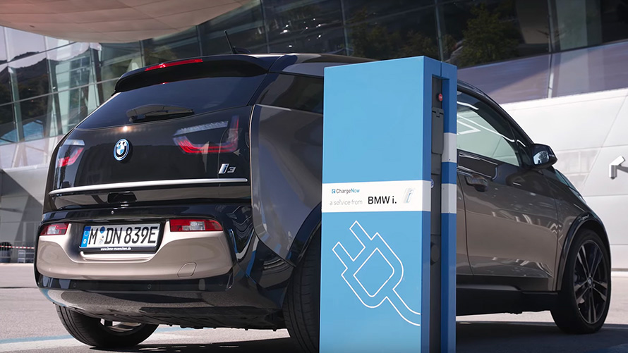 BMW i3 on charging station BMW i3 on charging station three-quarter rear view