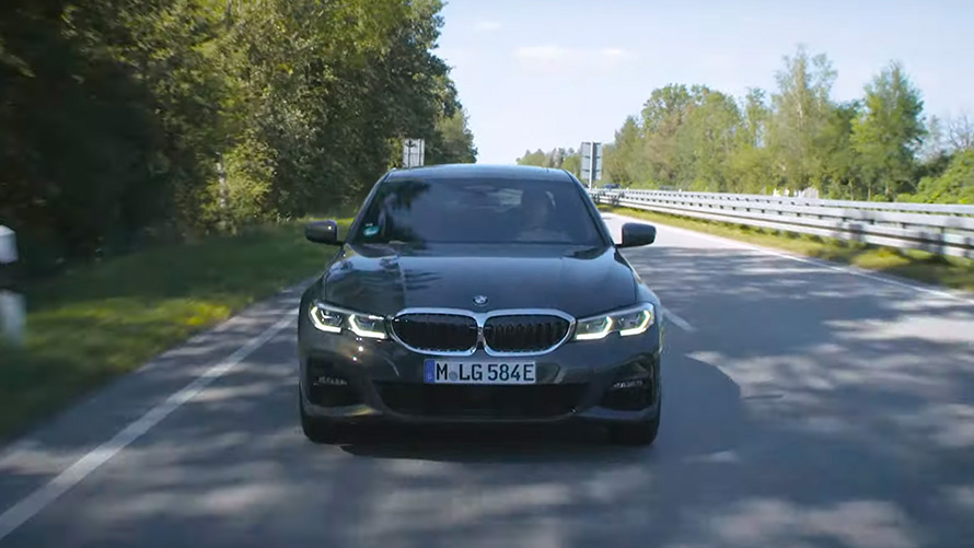 BMW plug-in hybrid driving on the street BMW plug-in hybrid driving on the street front view