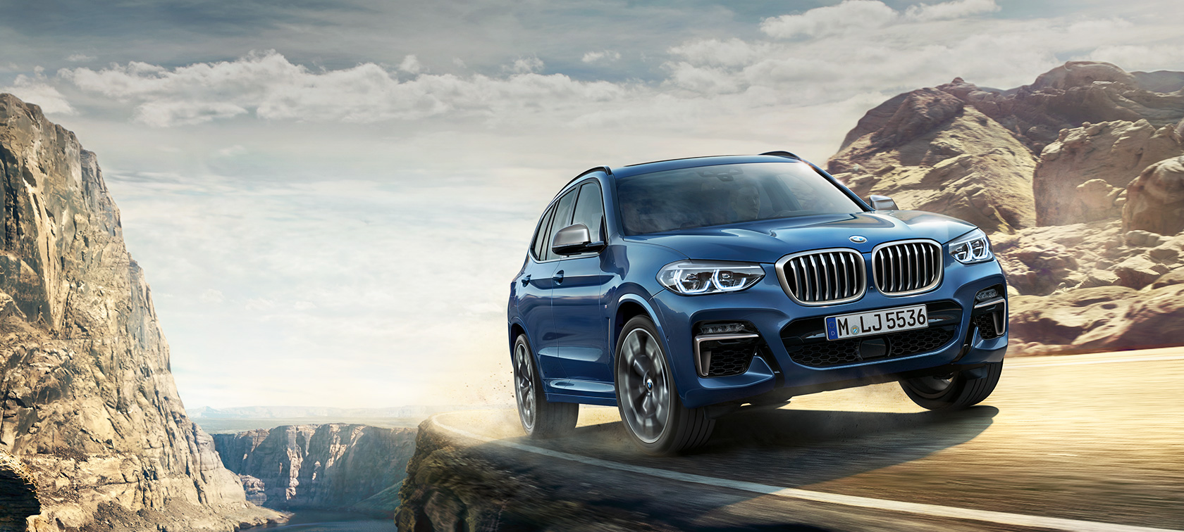 BMW X3 M40i on mountain trail, driving shot BMW X3 M40i on mountain trail, driving shot