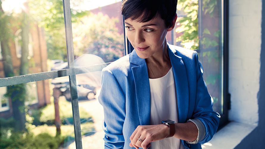BMW Connected App on smartwatch Woman using BMW Connected App on smartwatch