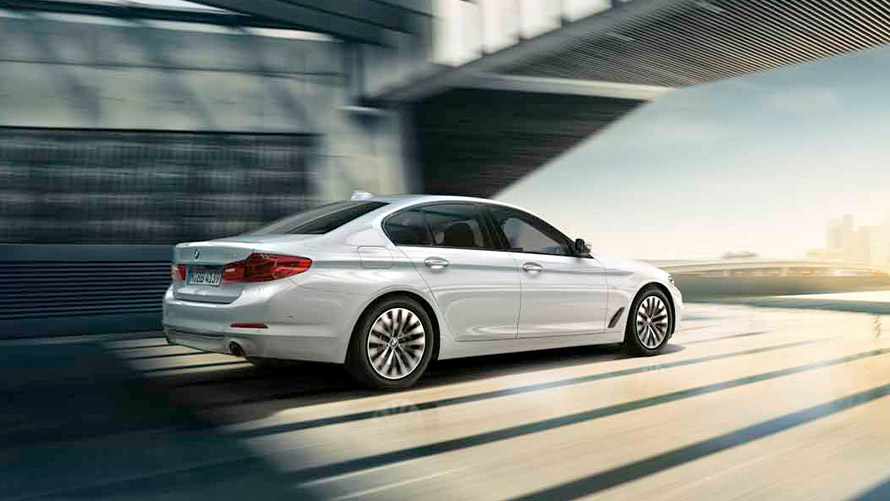 BMW 5 Series Sedan with Mild Hybrid Technology BMW 5 Series Sedan 2020 G30 with Mild Hybrid Technology in white driving