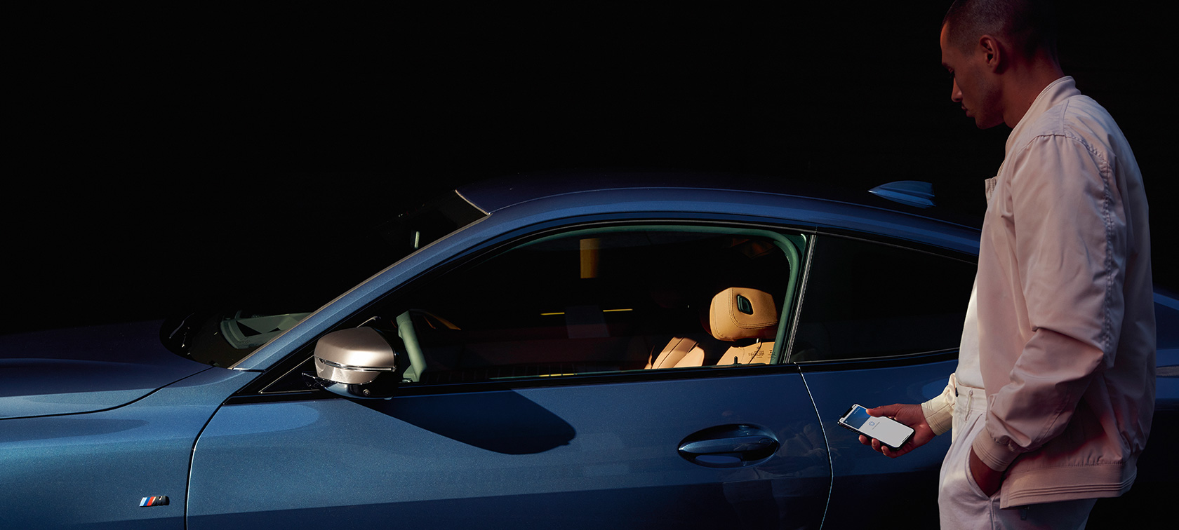BMW Digital Key BMW Digital Key My BMW App man opens BMW 4 Series Coupé with his smartphone
