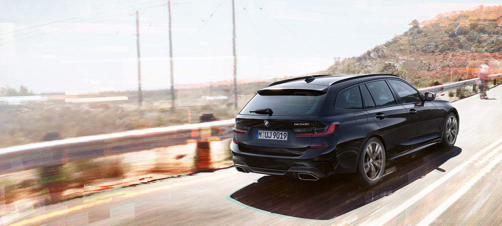 BMW M340i Touring rear 3/4 view BMW M340i Touring rear 3/4 view