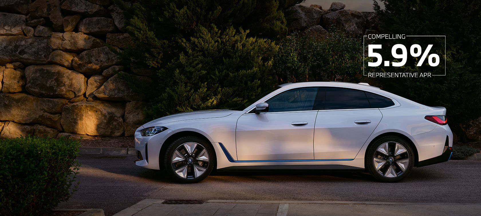 BMW i4 eDrive40 G26 2021 Mineral White side view parked with hill in background