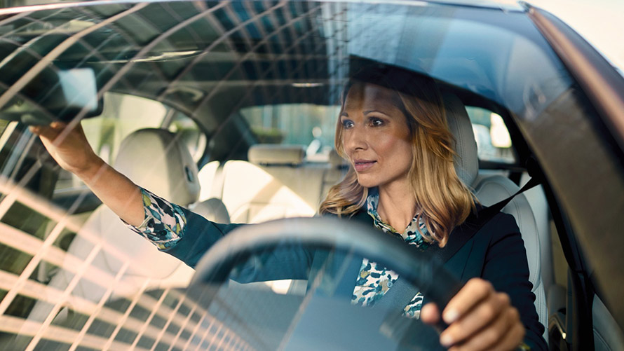 Woman sitting in new BMW