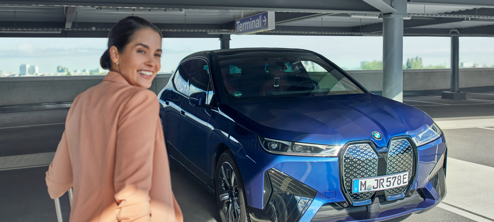 Woman smiling by BMW Woman smiling by BMW