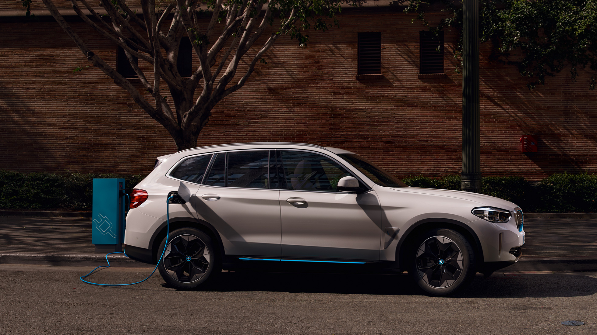 BMW iX3 charging at a public station BMW iX3 charging at a public station