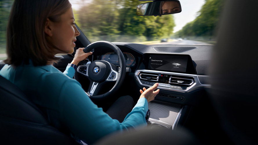 Woman using BMW ConnectedDrive Driver Assistance Woman using BMW ConnectedDrive Driver Assistance