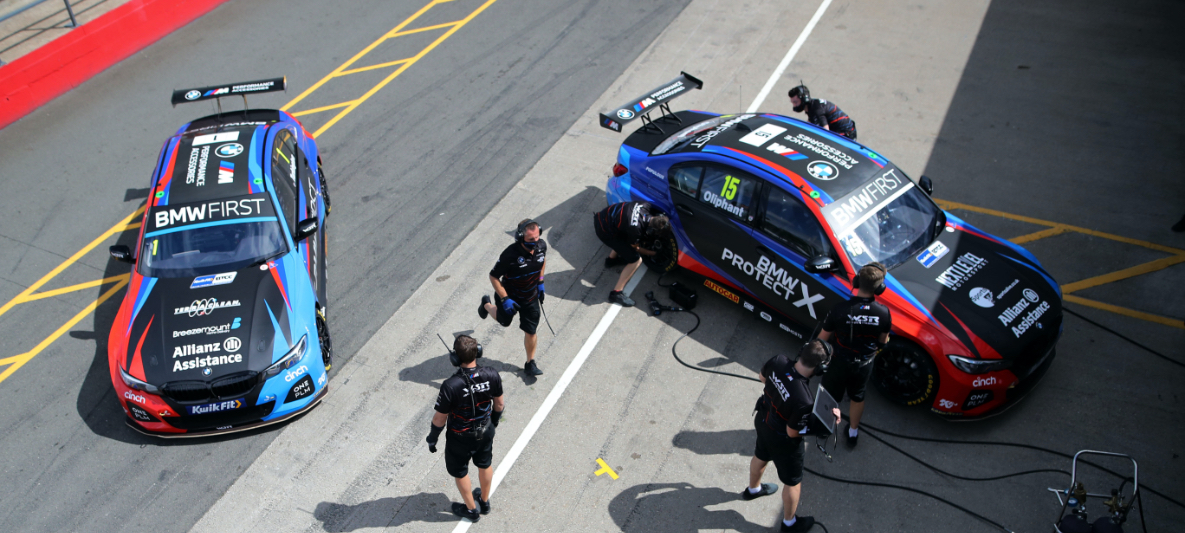 BMW M BTCC Race cars in pits