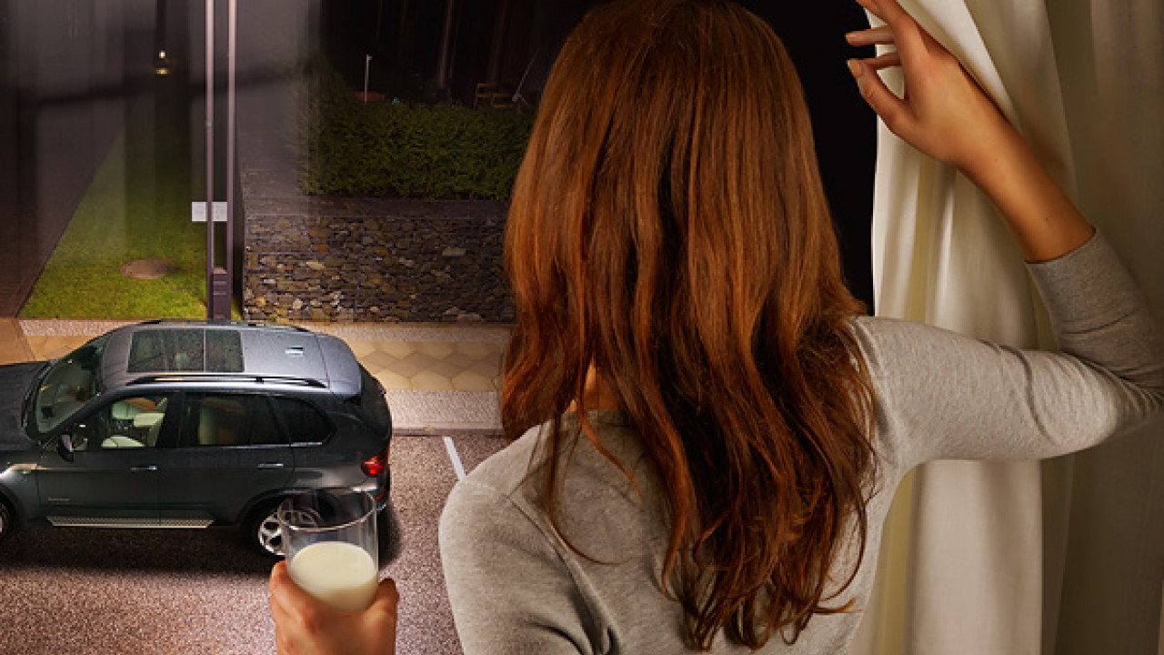 Woman looking at a BMW Woman looking at a BMW