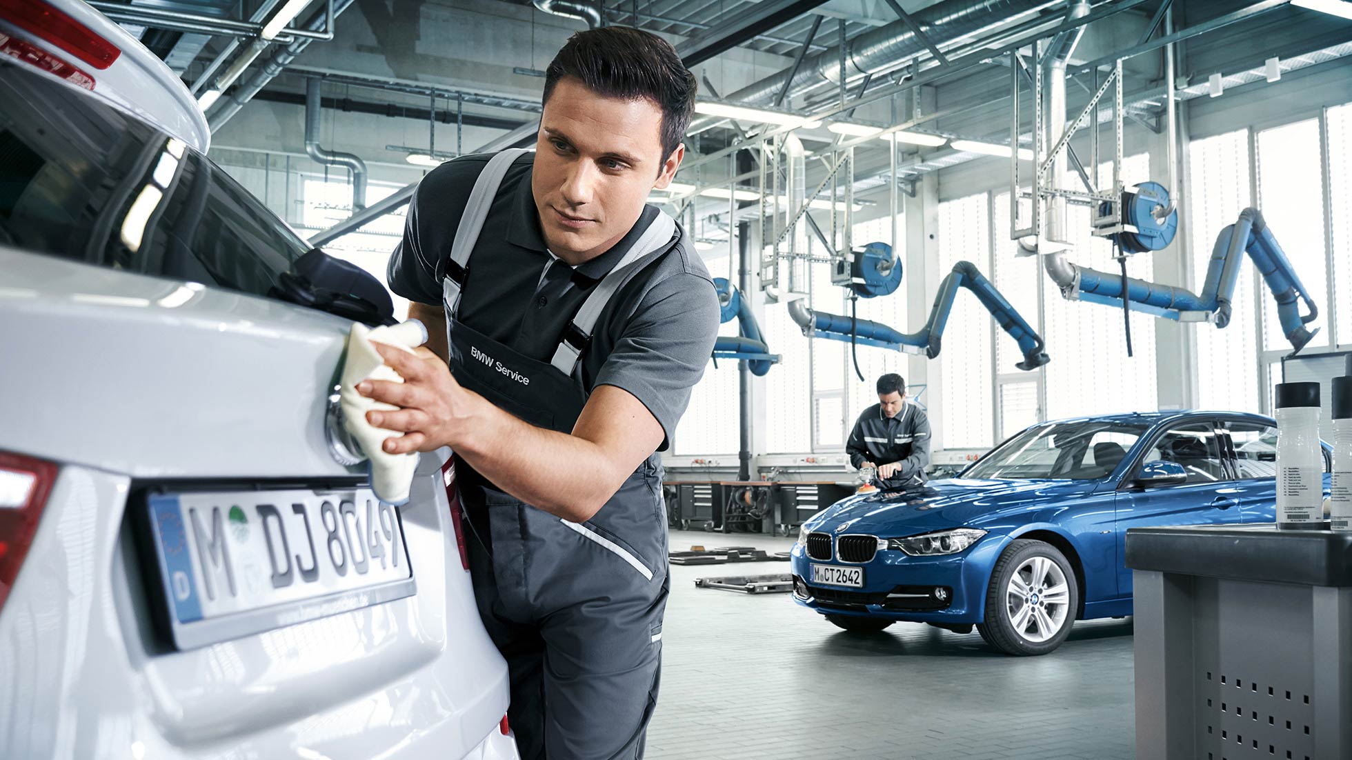 BMW bodywork being polished BMW bodywork being polished